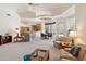 Open-concept living area with neutral carpet and decor, seamlessly connected to the kitchen at 11403 E Caron St, Scottsdale, AZ 85259