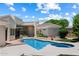 Beautiful backyard oasis with sparkling pool, hot tub, and lush landscaping at 11403 E Caron St, Scottsdale, AZ 85259