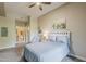 Comfortable bedroom with a queen-size bed, a view to the bathroom, and neutral decor at 11640 N Tatum Blvd # 2013, Phoenix, AZ 85028
