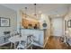 Charming dining area with seating for four, seamlessly flowing into the modern kitchen at 11640 N Tatum Blvd # 2013, Phoenix, AZ 85028