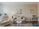Comfortable living room showcasing plush seating, a modern rug, and stylish artwork at 11640 N Tatum Blvd # 2013, Phoenix, AZ 85028