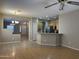 Open-concept living space features hardwood and tiled flooring, an island, and views into the kitchen at 11921 W Madison St, Avondale, AZ 85323