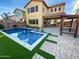 Backyard featuring a pool, patio, turf, privacy fence, and a covered gazebo style structure at 12211 W Prickly Pear Trl, Peoria, AZ 85383