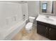 Standard bathroom featuring a shower and bathtub, toilet, vanity with sink, and tile flooring at 12211 W Prickly Pear Trl, Peoria, AZ 85383