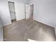 A comfortable carpeted bedroom with a closet and a neutral color scheme at 12211 W Prickly Pear Trl, Peoria, AZ 85383