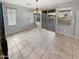 Light and bright dining room with tile flooring and glass doors to the patio at 12211 W Prickly Pear Trl, Peoria, AZ 85383