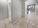 Neutral hallway with tile flooring and multiple doorways leading to other parts of the home at 12211 W Prickly Pear Trl, Peoria, AZ 85383