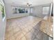 Bright living room featuring neutral paint, a ceiling fan and oversized tile flooring at 12211 W Prickly Pear Trl, Peoria, AZ 85383