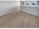 Bright loft featuring neutral paint, three windows and soft carpet flooring at 12211 W Prickly Pear Trl, Peoria, AZ 85383