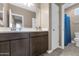 Bathroom with double vanity, wood cabinets and large mirror providing great lighting at 1255 N Arizona Ave # 1251, Chandler, AZ 85225
