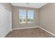 This cozy bedroom features plush carpet, neutral walls, and bright natural light at 1255 N Arizona Ave # 1251, Chandler, AZ 85225
