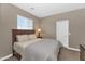 Cozy bedroom with neutral walls, plush carpet, a window, and ample natural light at 1255 N Arizona Ave # 1251, Chandler, AZ 85225