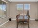 Bright dining room with a wooden table, comfortable seating, and natural light from the windows at 1255 N Arizona Ave # 1251, Chandler, AZ 85225