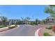 Welcoming entrance to the community with well-maintained landscaping and secure gate at 1255 N Arizona Ave # 1251, Chandler, AZ 85225