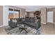 Spacious living room with a comfortable sectional sofa and access to the backyard at 1255 N Arizona Ave # 1251, Chandler, AZ 85225