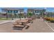 Charming community picnic area with multiple tables and barbecue grills for outdoor gatherings at 1255 N Arizona Ave # 1251, Chandler, AZ 85225