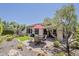 Well-maintained backyard with artificial turf, patio dining set, and low-maintenance desert landscaping at 12738 W Brookhart Way, Peoria, AZ 85383
