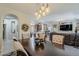 Elegant dining room with decorative lighting and easy access to other rooms at 12738 W Brookhart Way, Peoria, AZ 85383