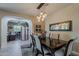 Charming dining room with stylish lighting, decor, and easy access to the office at 12738 W Brookhart Way, Peoria, AZ 85383