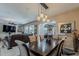 Dining room features elegant lighting, neutral paint, and easy access to other rooms at 12738 W Brookhart Way, Peoria, AZ 85383