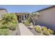 Desert landscaping with cacti, trees, shrubs, and brick paved walkway at 12738 W Brookhart Way, Peoria, AZ 85383