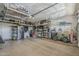 Spacious garage featuring ample storage, shelving, and a workbench, catering to various storage needs at 12738 W Brookhart Way, Peoria, AZ 85383