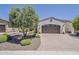 Attached two car garage with brick paved driveway and desert landscaping at 12738 W Brookhart Way, Peoria, AZ 85383