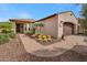 Attached two car garage with brick paved driveway and desert landscaping at 12738 W Brookhart Way, Peoria, AZ 85383