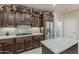 Modern kitchen featuring stainless steel appliances, granite counters and gas range at 12738 W Brookhart Way, Peoria, AZ 85383