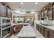Modern kitchen with stainless appliances, granite counters and a center island at 12738 W Brookhart Way, Peoria, AZ 85383