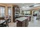 Modern kitchen with stainless appliances, granite counters and a center island at 12738 W Brookhart Way, Peoria, AZ 85383