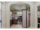 Open view of the home office featuring custom built-ins and a large window, creating a productive workspace at 12738 W Brookhart Way, Peoria, AZ 85383