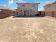 Spacious backyard featuring a covered patio, perfect for outdoor entertaining and relaxation at 12801 N El Frio St, El Mirage, AZ 85335