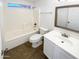Clean bathroom featuring a shower over tub, vanity, and toilet at 12801 N El Frio St, El Mirage, AZ 85335