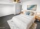 Bright Primary bedroom featuring a ceiling fan, carpet and an open closet for maximum storage at 12801 N El Frio St, El Mirage, AZ 85335