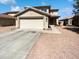 Charming two-story home featuring a two-car garage and desert landscaping at 12801 N El Frio St, El Mirage, AZ 85335