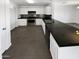 Well-equipped kitchen with stainless steel appliances and dark granite countertops at 12801 N El Frio St, El Mirage, AZ 85335