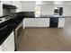 Modern kitchen featuring granite countertops and stainless steel appliances at 12801 N El Frio St, El Mirage, AZ 85335