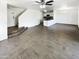 Bright living room showcasing open floor plan with tile flooring and natural light at 12801 N El Frio St, El Mirage, AZ 85335