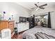 Bedroom featuring wood floors, ceiling fan, and sliding glass doors to a patio at 1350 S Greenfield Rd # 2159, Mesa, AZ 85206