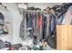 Walk-in closet full of clothing and storage at 1350 S Greenfield Rd # 2159, Mesa, AZ 85206