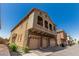 Desirable townhome with three-car garage, a balcony and appealing exterior at 1350 S Greenfield Rd # 2159, Mesa, AZ 85206