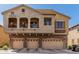 Inviting townhome showcasing a three-car garage and upper-level balconies at 1350 S Greenfield Rd # 2159, Mesa, AZ 85206