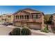 Beautiful two-story townhome with stone accents, private balconies, and three-car garage at 1350 S Greenfield Rd # 2159, Mesa, AZ 85206
