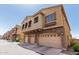 Charming townhome featuring an attached three-car garage and balcony at 1350 S Greenfield Rd # 2159, Mesa, AZ 85206