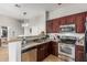 Open concept kitchen with stainless steel appliances, and granite counter tops at 1350 S Greenfield Rd # 2159, Mesa, AZ 85206