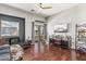 Spacious living room with hardwood floors and a ceiling fan creating a comfortable atmosphere at 1350 S Greenfield Rd # 2159, Mesa, AZ 85206