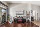Bright living room featuring modern entertainment setup and sliding door access to outdoor space at 1350 S Greenfield Rd # 2159, Mesa, AZ 85206