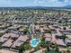 Community aerial with lush landscaping, neighborhood pool and mountain views at 13633 W Alvarado Dr, Goodyear, AZ 85395