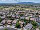 Aerial view of community with golf course in background and private pools at 13633 W Alvarado Dr, Goodyear, AZ 85395